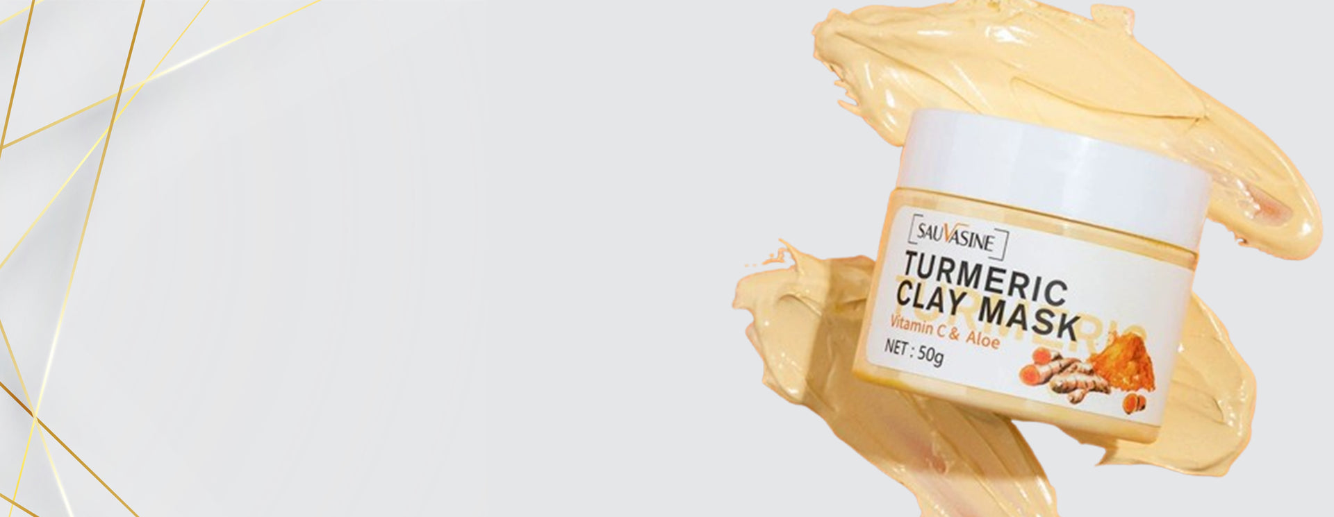 Turmeric clay mask jar with a smear of mask on a light gray background